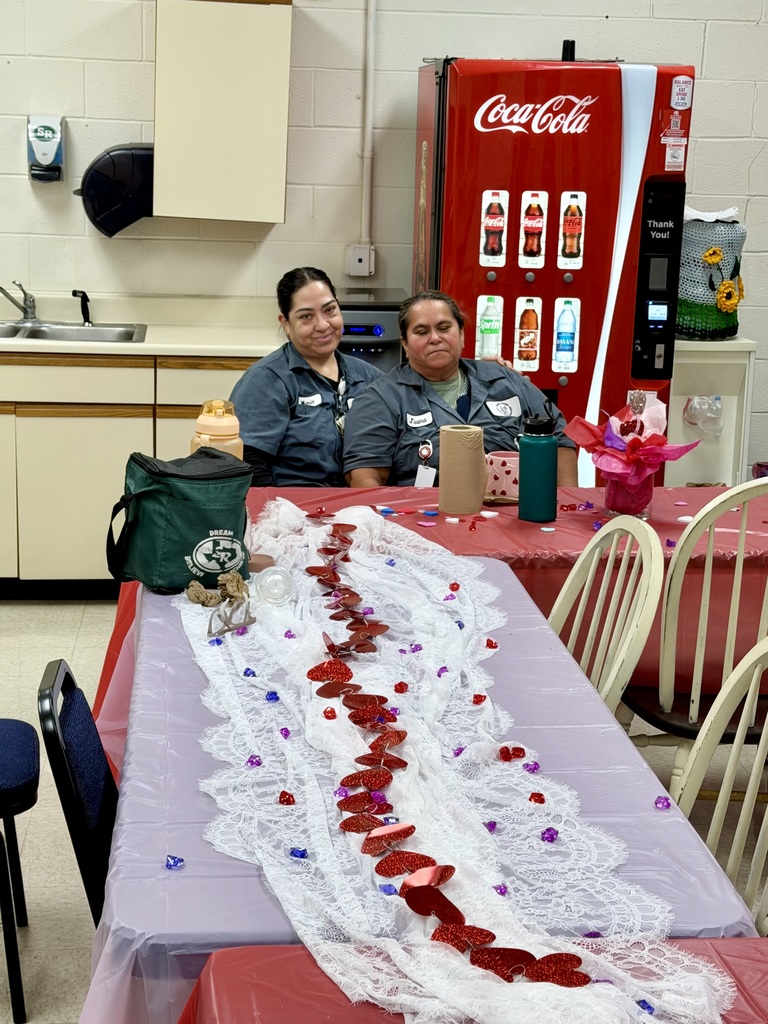 Two staff memebers taking a picture