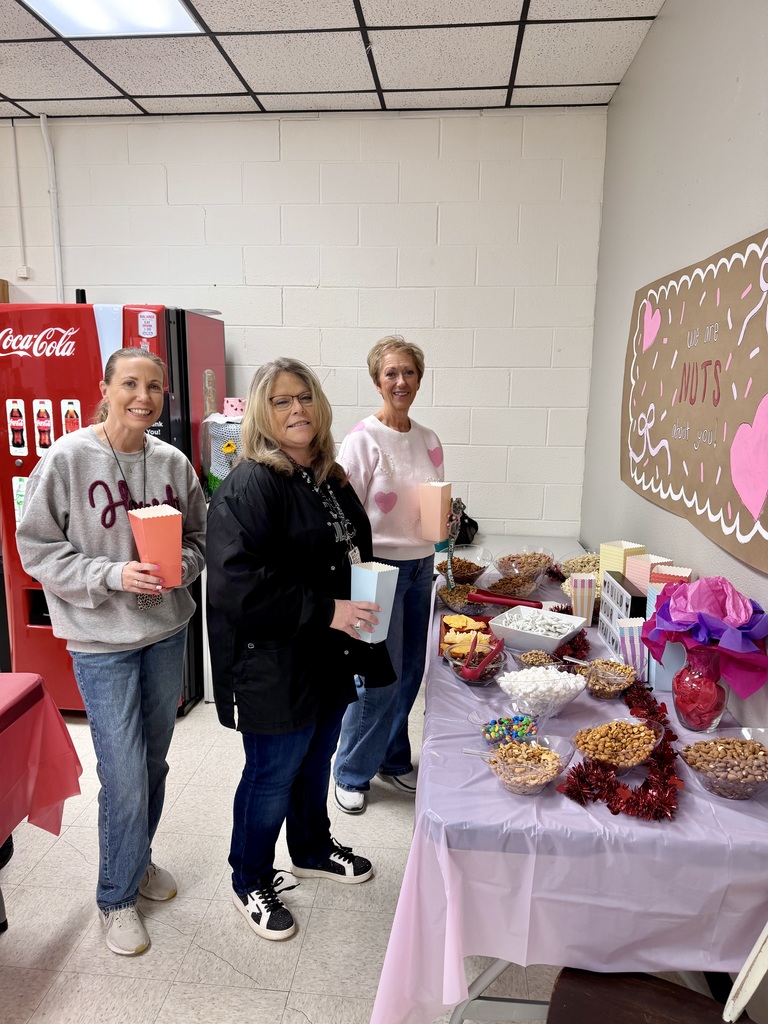 Three staff memebers taking a picture