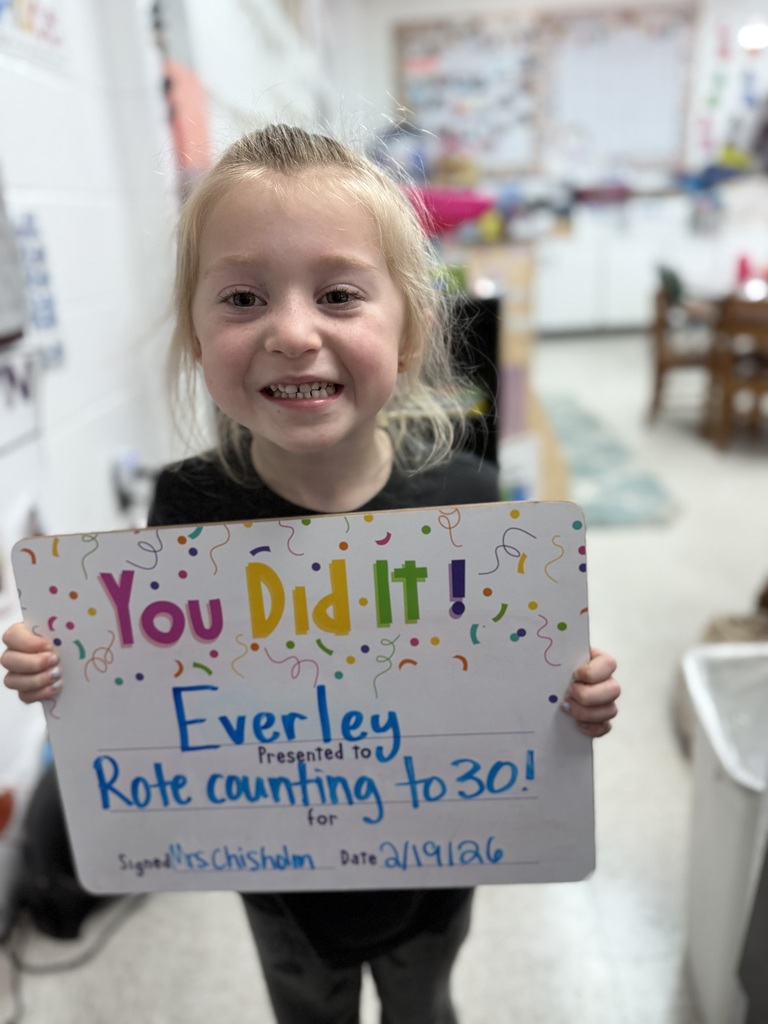 child with celebration board