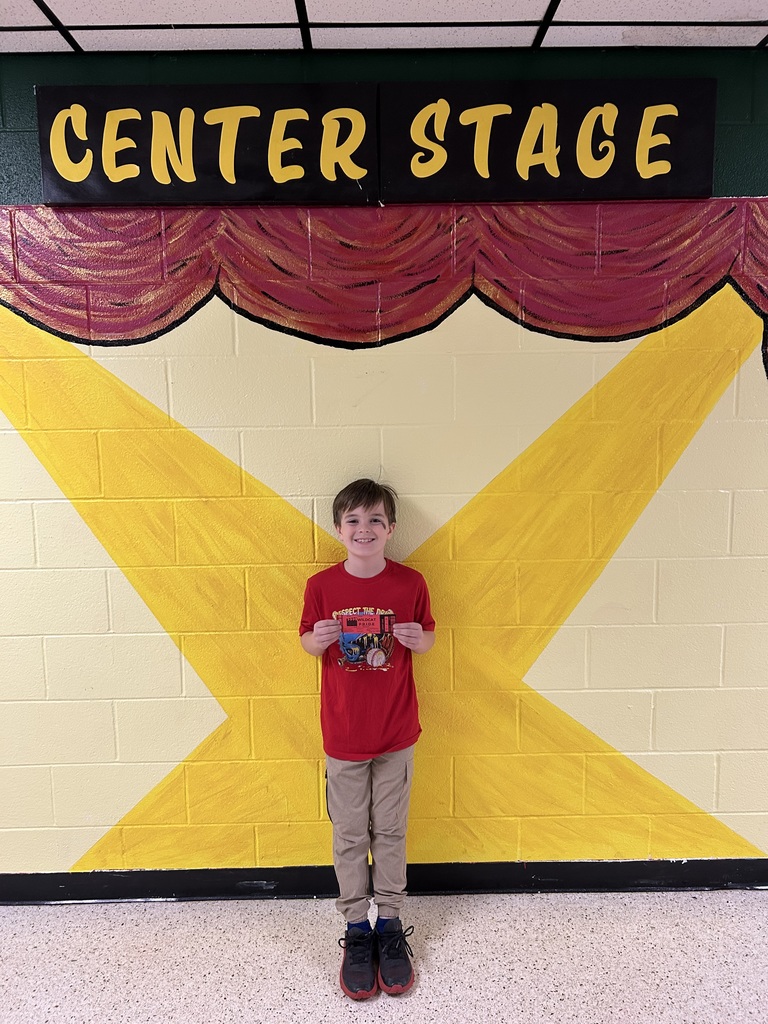 Smiling student holding wildcat certificate