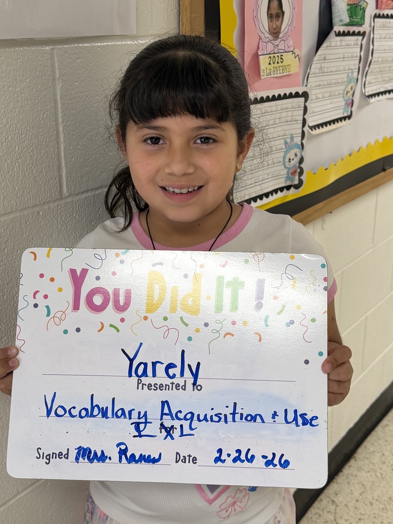 Smiling child holding celebration board
