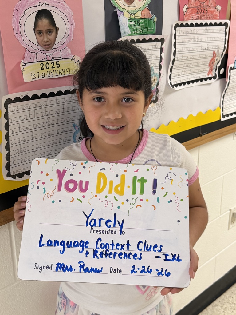 Smiling child holding celebration board