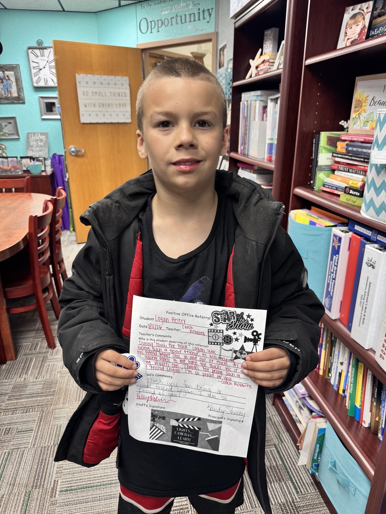 Child holding piece of paper
