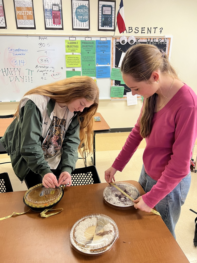 two female students measuing a pie