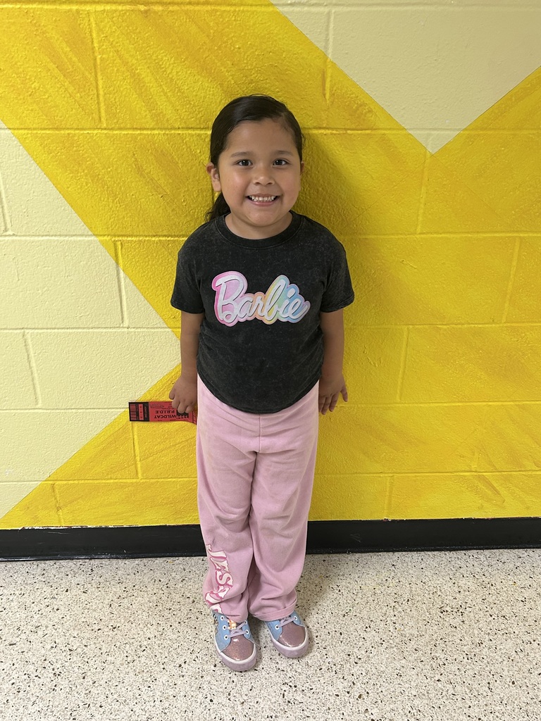 child holding recognition award