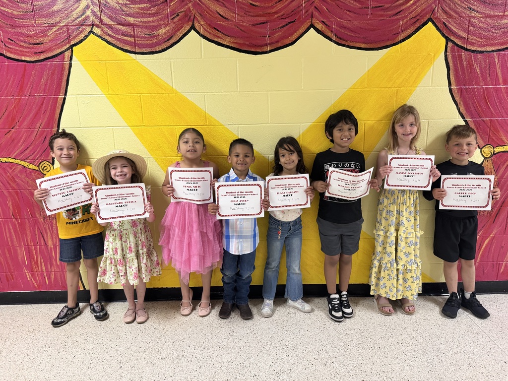 Group of smiling children holding certificates
