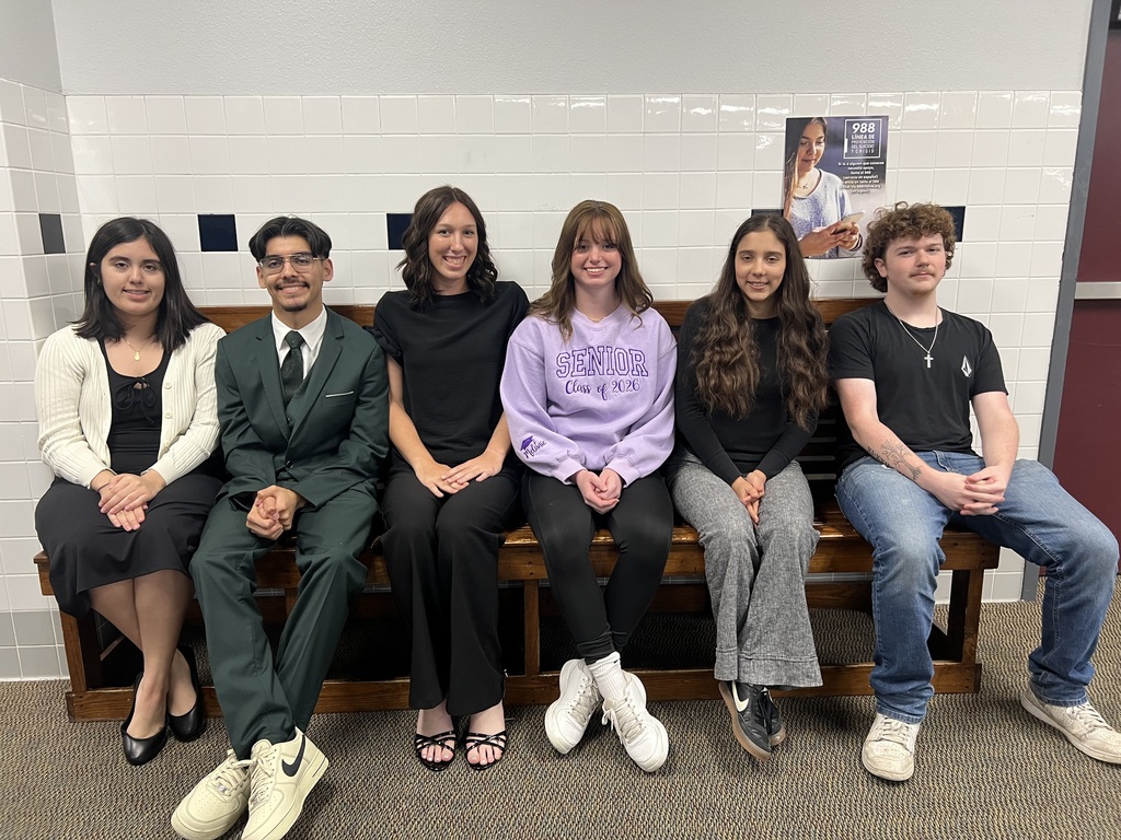 six students sitting together and waiting for competition
