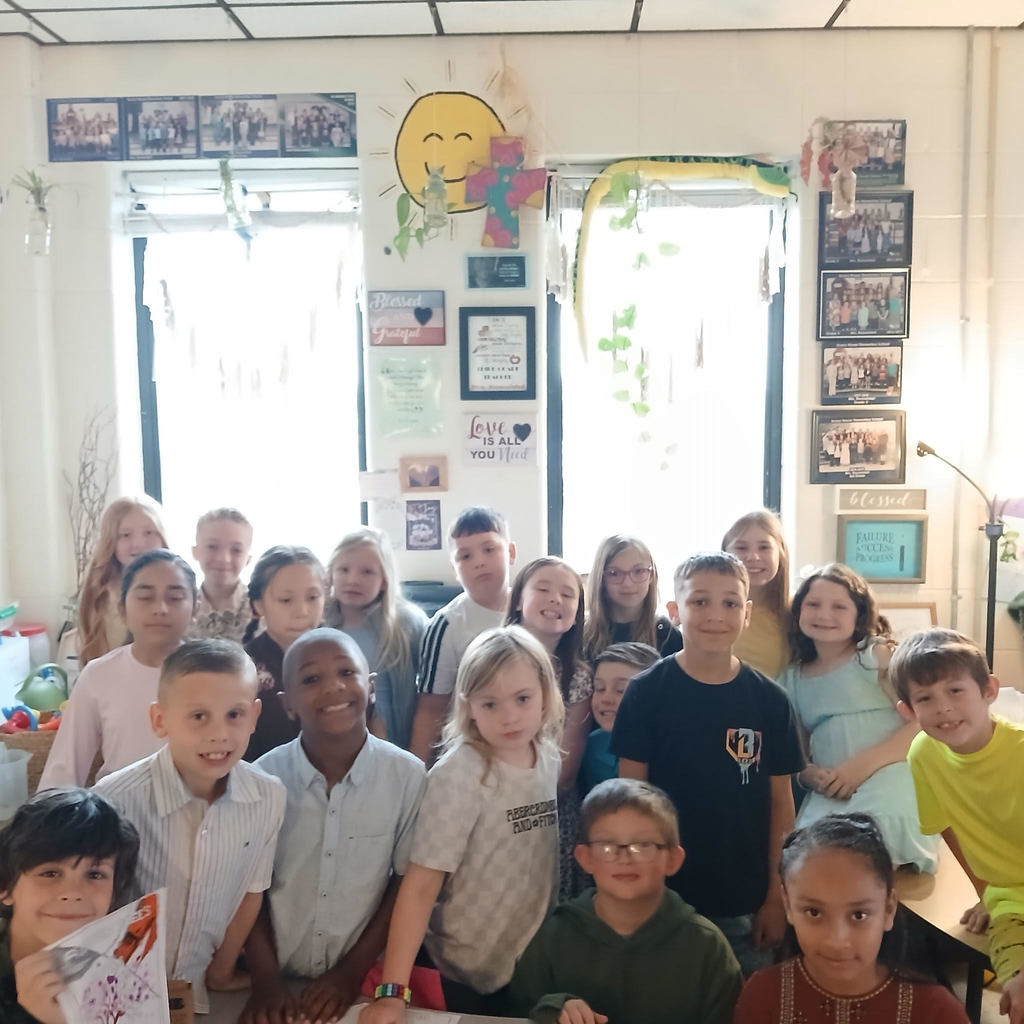 3rd grade students planting seeds 