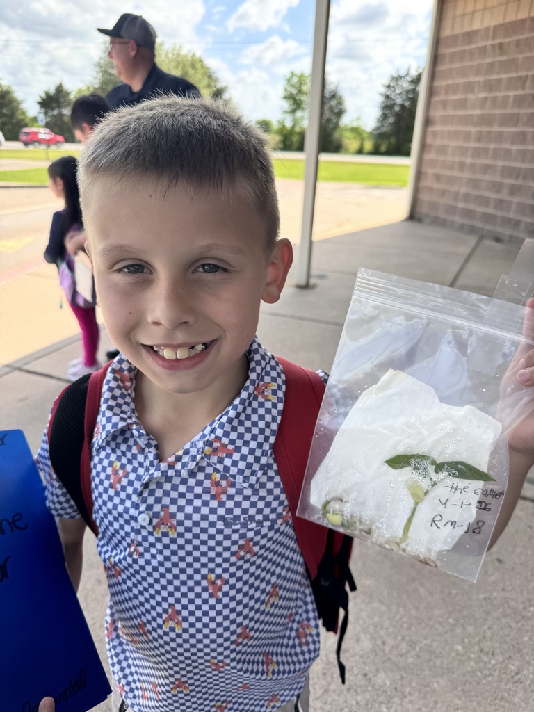 3rd grade students planting seeds