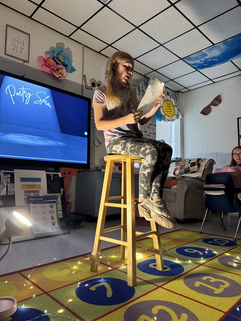 Students showcasing and reading poetry.