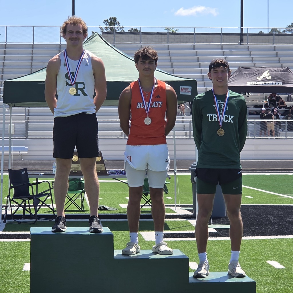 three male athletics standing on levels of boxes for 1st, 2nd and 3rd place medals