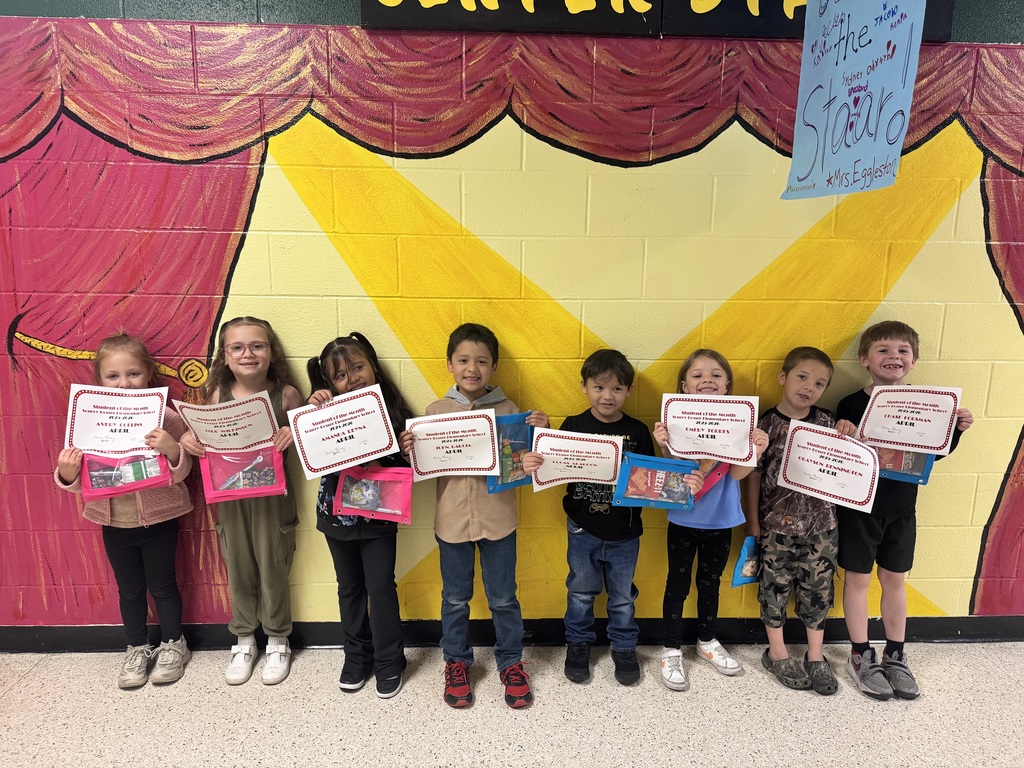 happy students holding certificates