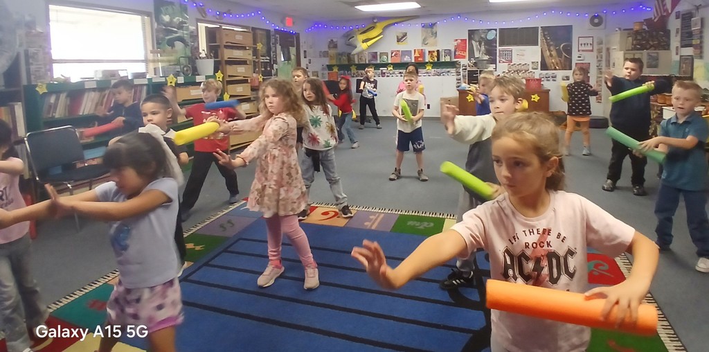 group of students practicing their light saber skills in music.  Technique is used as a musical skill.