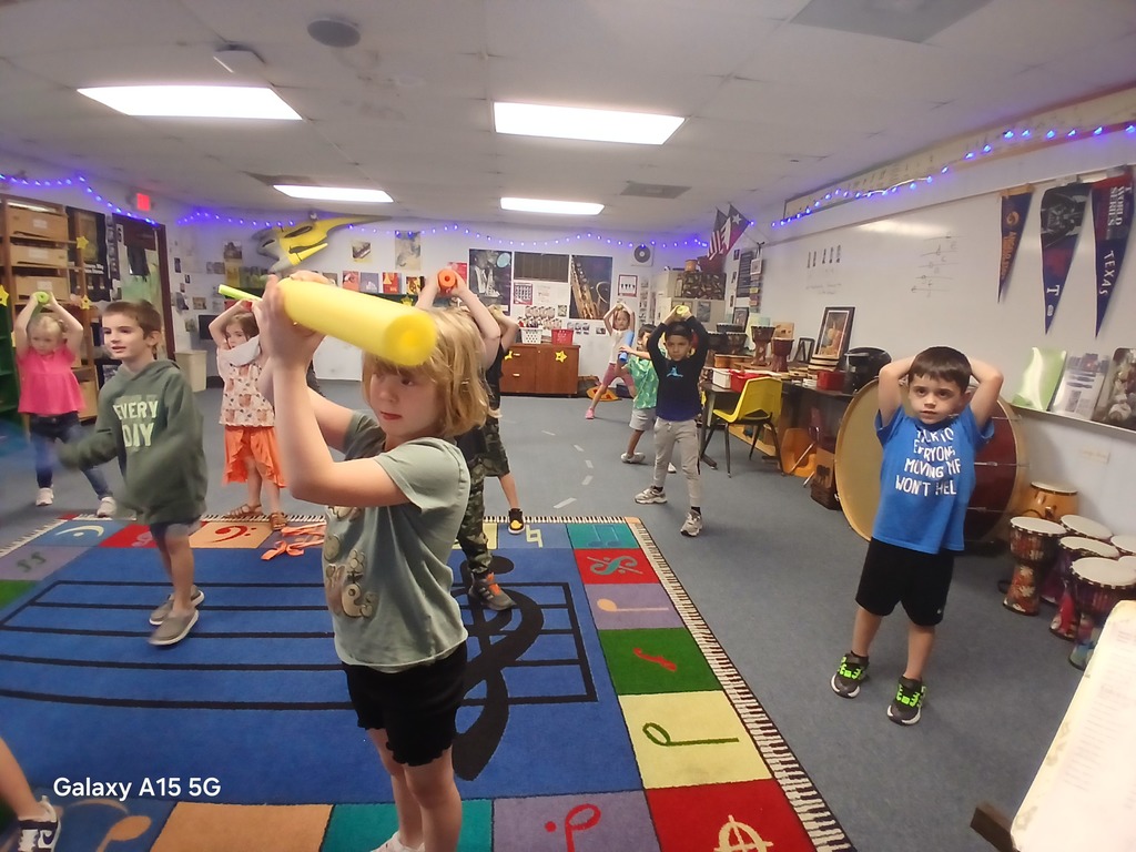 group of students practicing their light saber skills in music.  Technique is used as a musical skill.