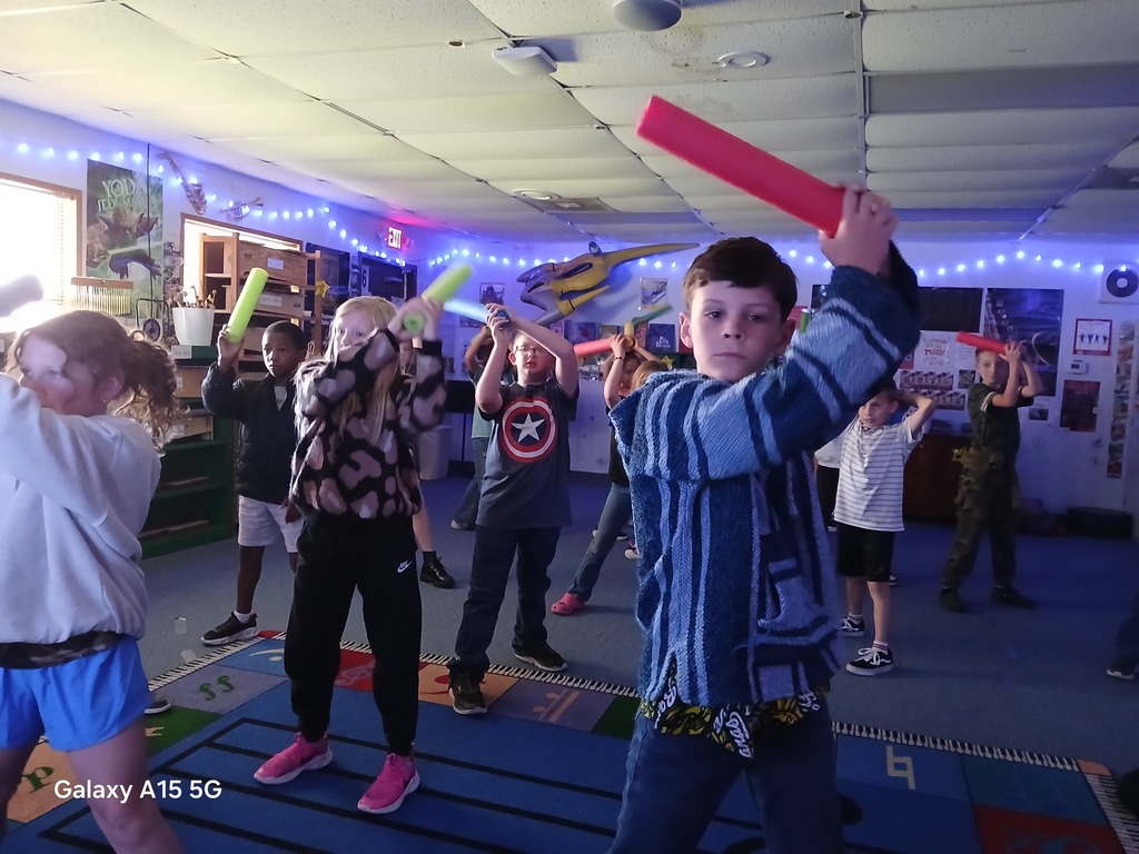 group of students practicing their light saber skills in music.  Technique is used as a musical skill.