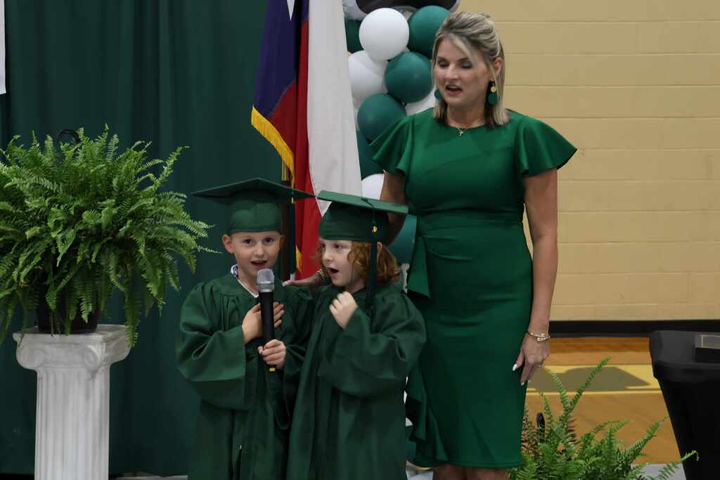 princiapl, male and female kindergarten student reciting the pledge