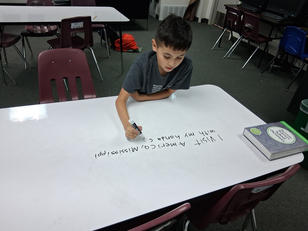 Students writing on table