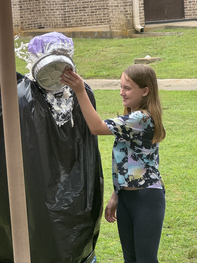 Student pieing the teacher