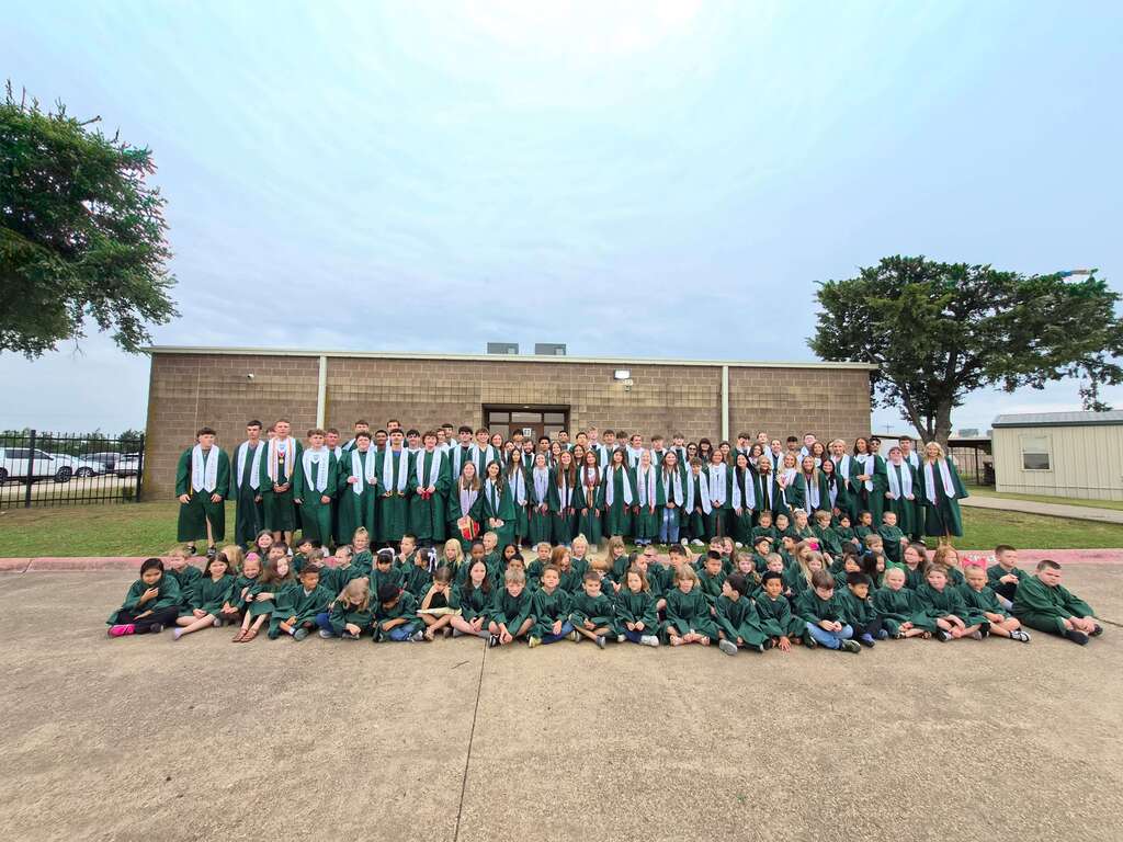 group photo of graduating seniors and kindergarten graduates