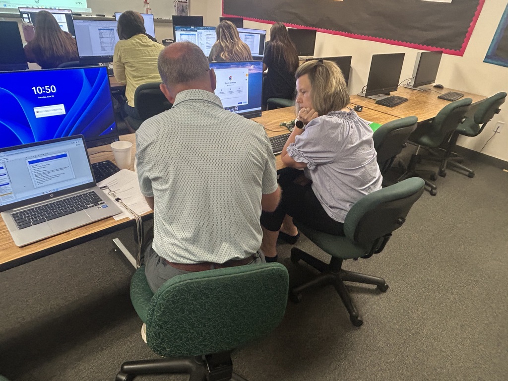 group of teachers discussing data