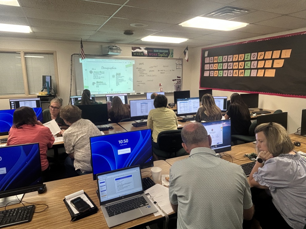 group of teachers  discussing data