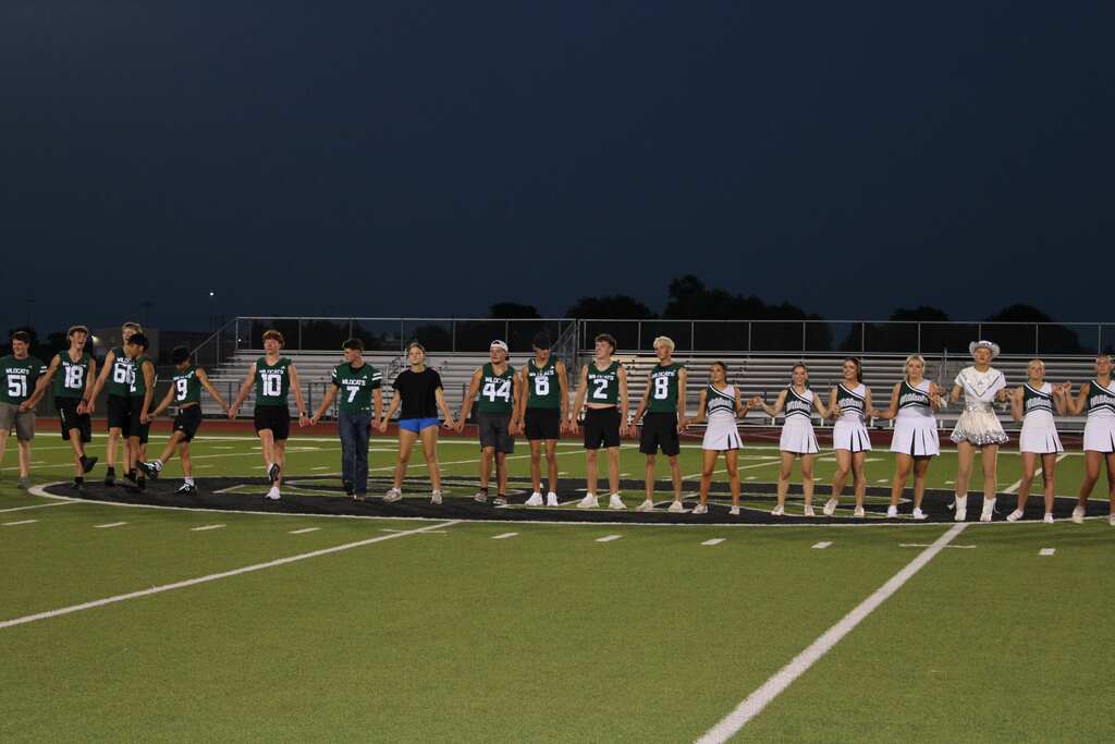 seniors on the field for fight song