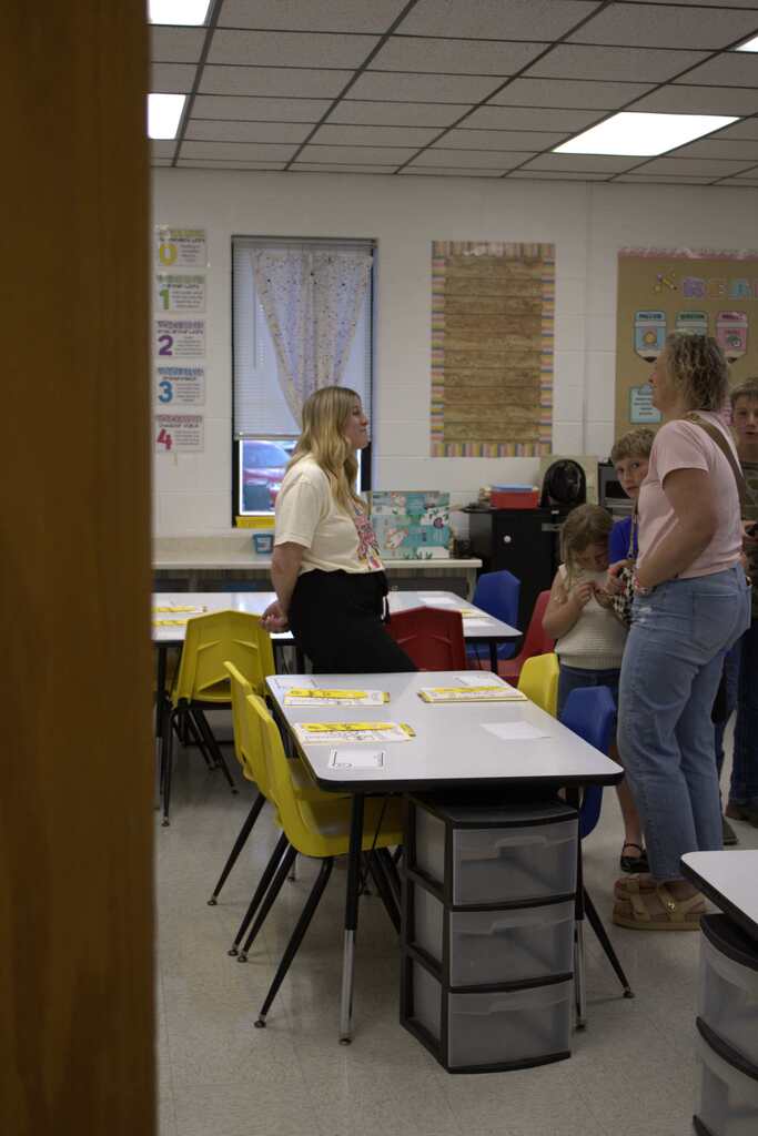 parent and teacher at middle school meet the teacher
