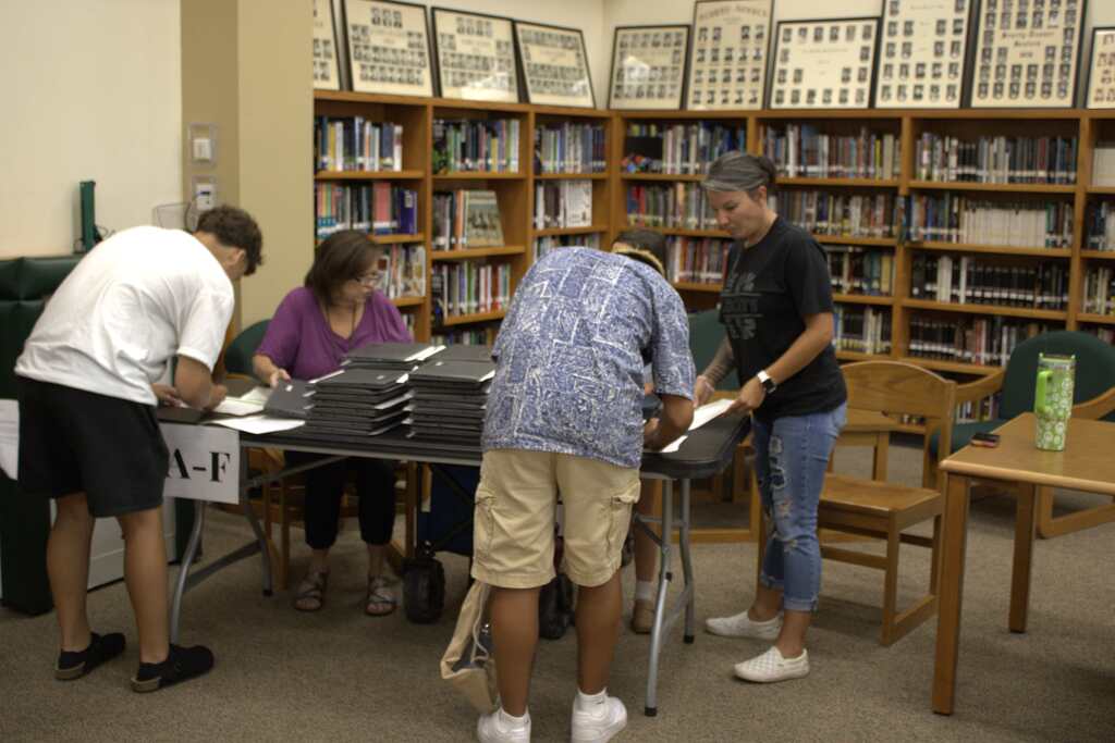 students reiving their chromebooks at fish camp