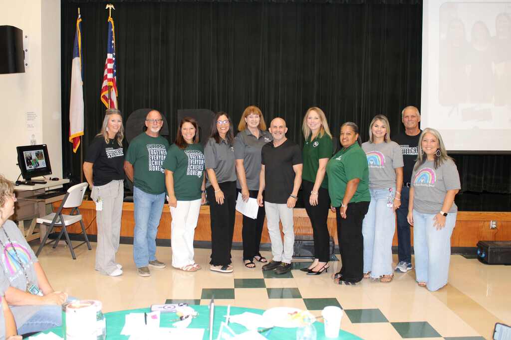district leadership standing with hal bowman for a group photo