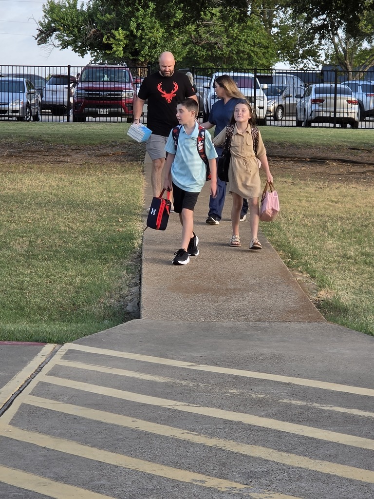 students walking into school