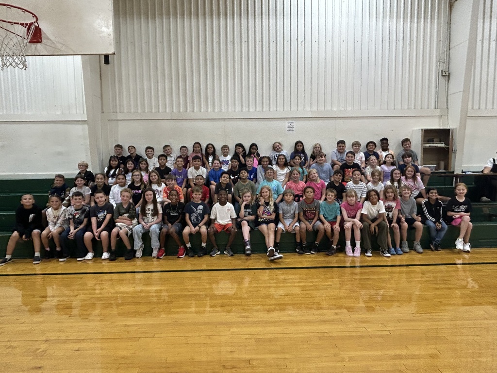 group of student posed in the gym