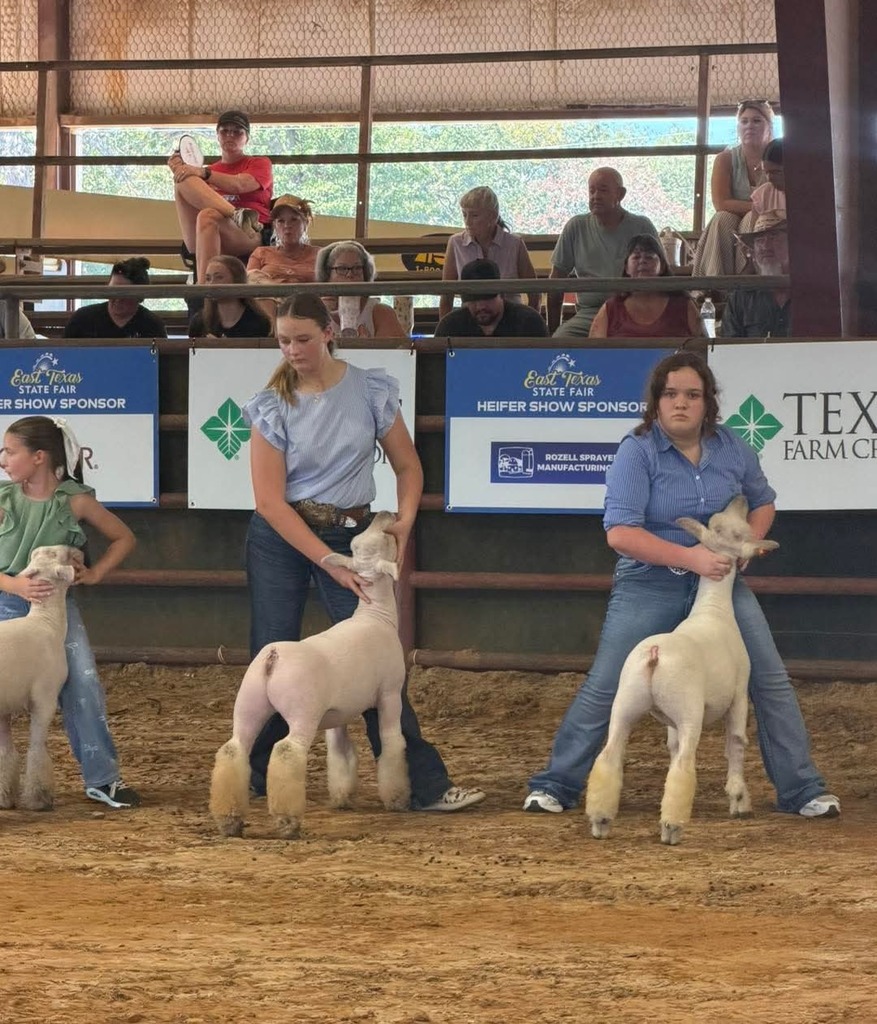 students posing their lambs