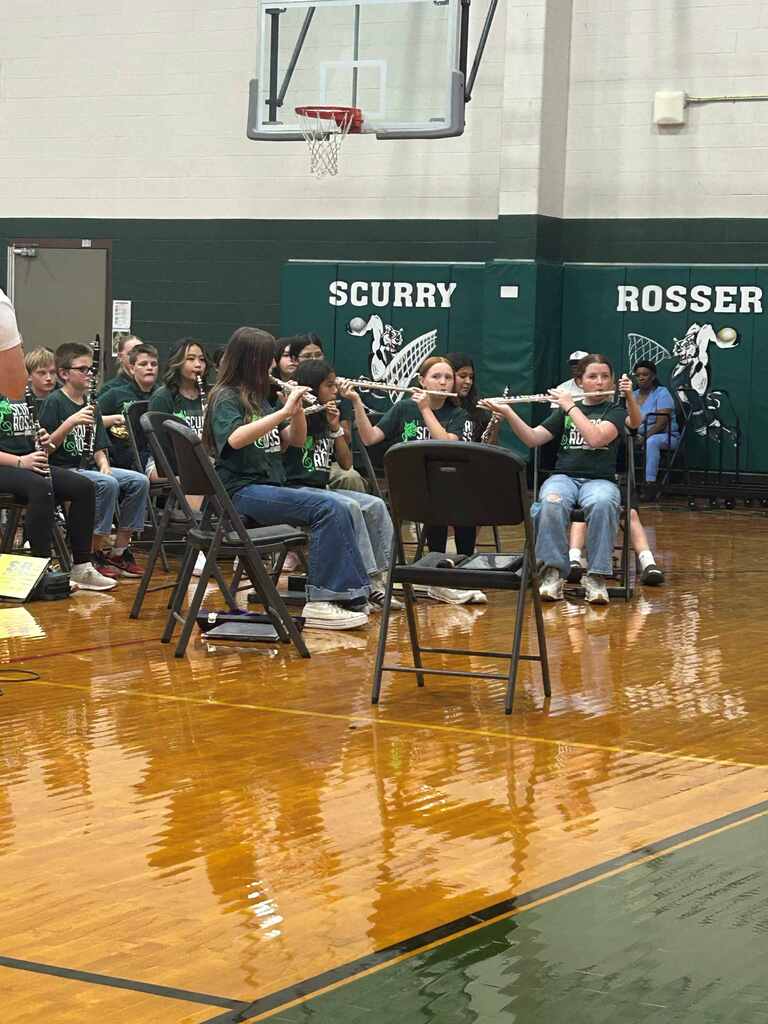 group of band students playing their instrument