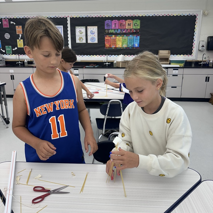 Third grade is up to a challenge, a marshmallow challenge! What team can balance a marshmallow on top of spaghetti?