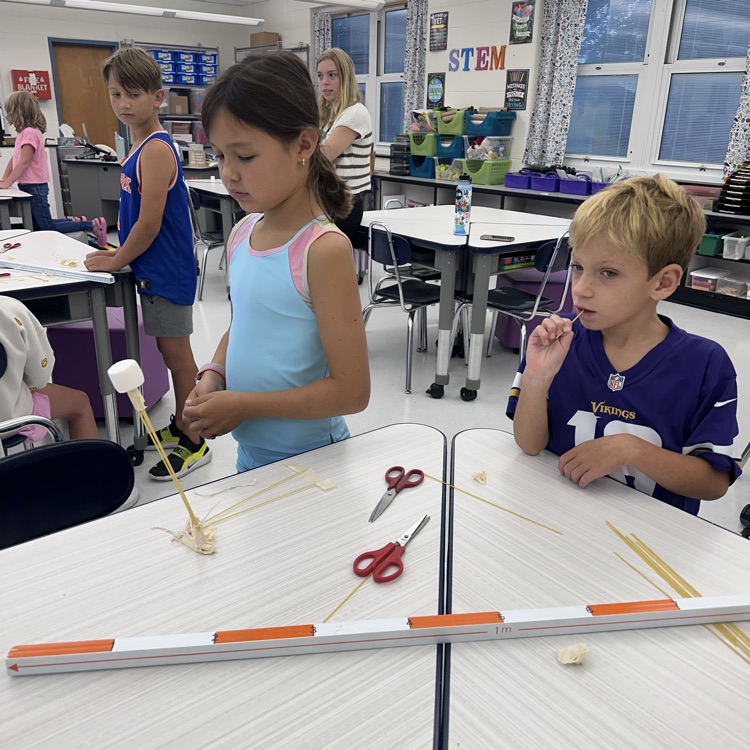 Third grade is up to a challenge, a marshmallow challenge! What team can balance a marshmallow on top of spaghetti?
