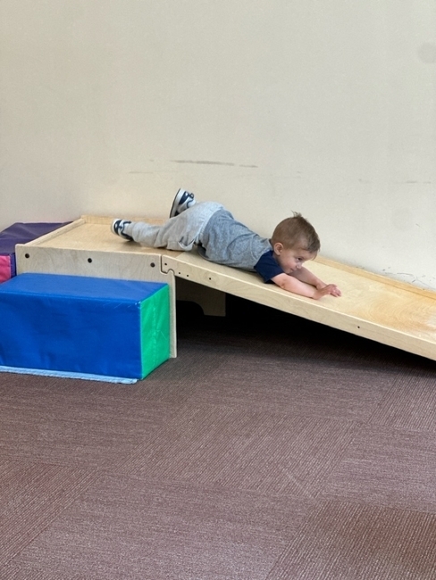 Guppy Sliding down slide