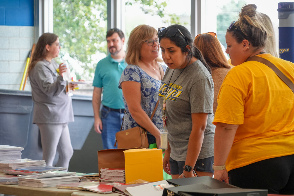 teachers shopping for school supplies at an event