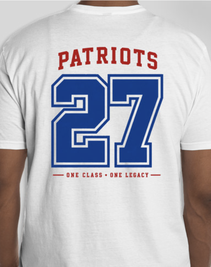 A white T-shirt with "Patriots" and "27" in blue. Below "27," a slogan reads "ONE CLASS ONE LEGACY" in red.