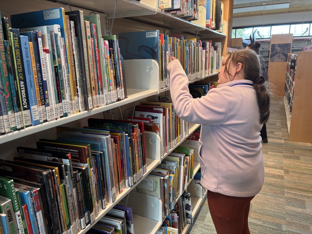Samish Elementary students explore the Central Skagit Library, browsing bookshelves, learning how to use the library’s search system, and enjoying the play area during their field trip.