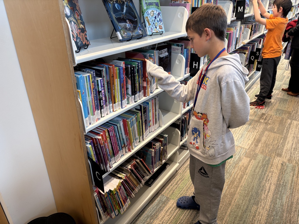 Samish Elementary students explore the Central Skagit Library, browsing bookshelves, learning how to use the library’s search system, and enjoying the play area during their field trip.