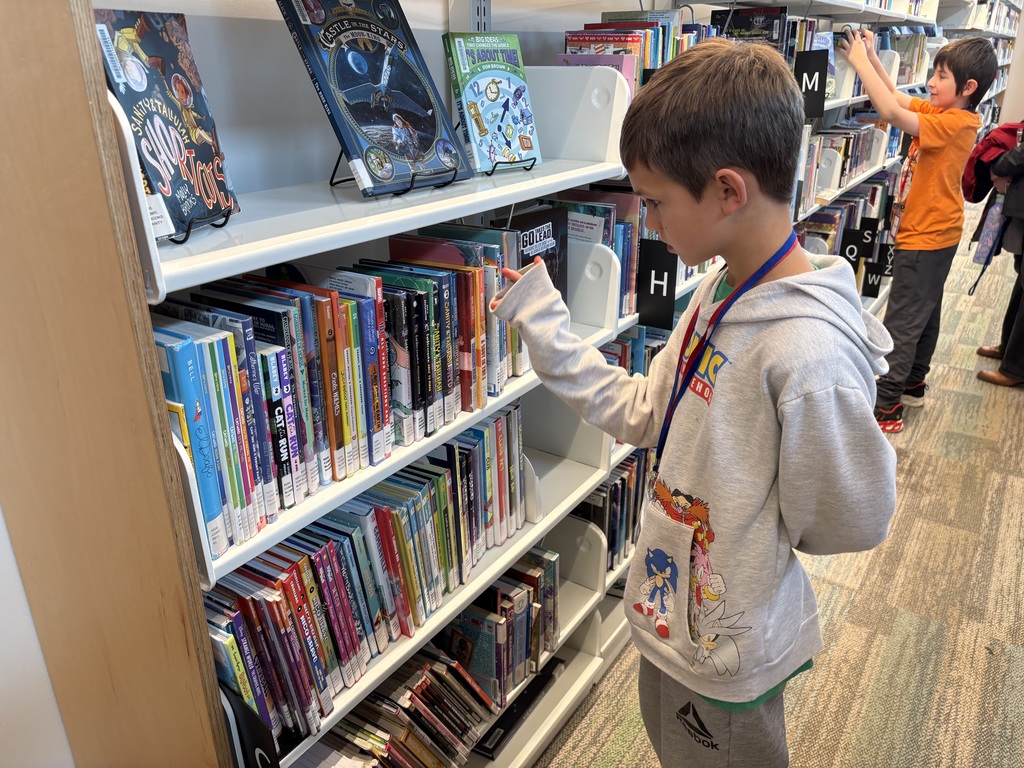 Samish Elementary students explore the Central Skagit Library, browsing bookshelves, learning how to use the library’s search system, and enjoying the play area during their field trip.