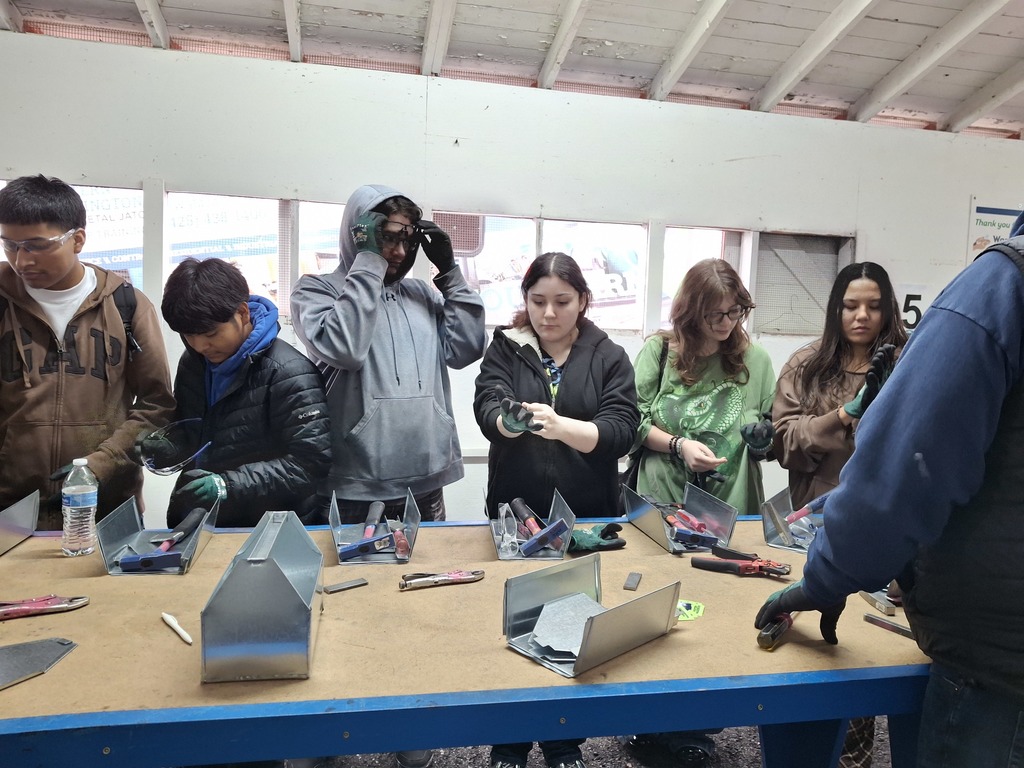 Students used metal tools to assemble a small metal toolbox during the WAVE tour workshop with Western Sheet Metal.