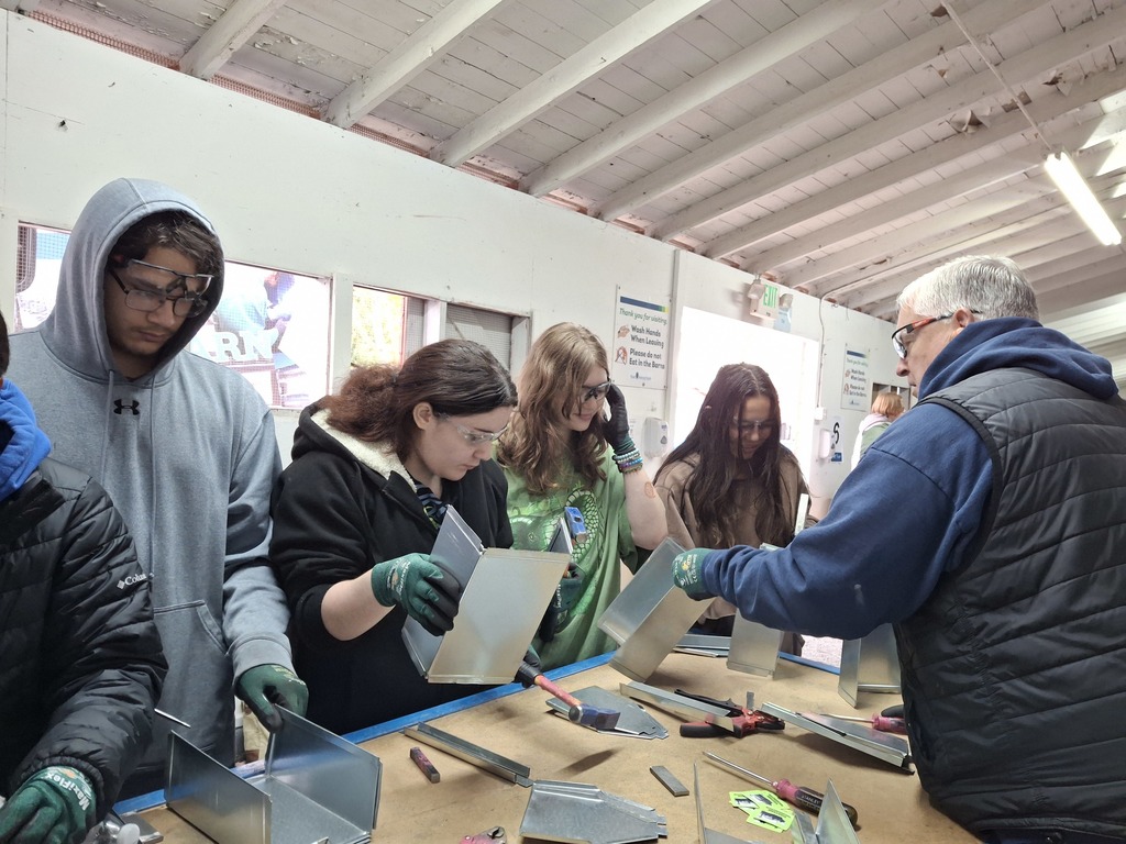 Students used metal tools to assemble a small metal toolbox during the WAVE tour workshop with Western Sheet Metal.