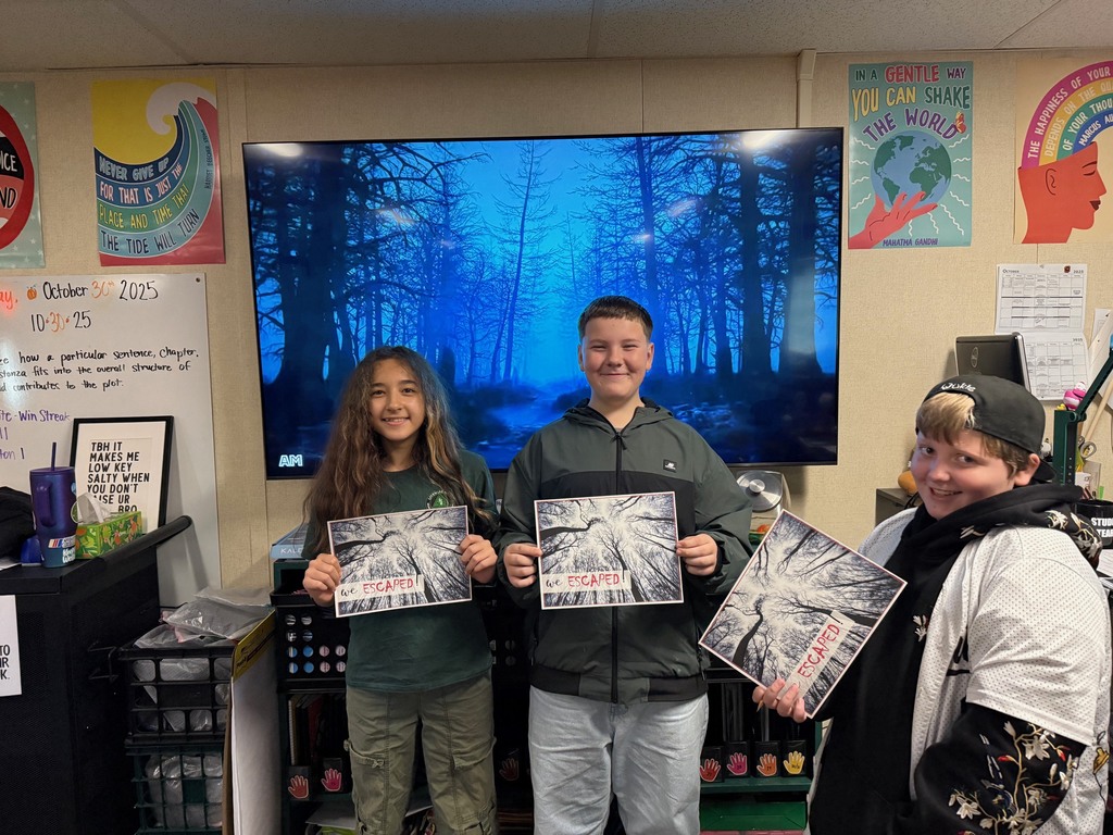 6th grade students work in small groups during a Halloween-themed classroom escape room challenge. Students are reading clues, solving puzzles, and discussing story elements together as part of a spooky ELA activity.