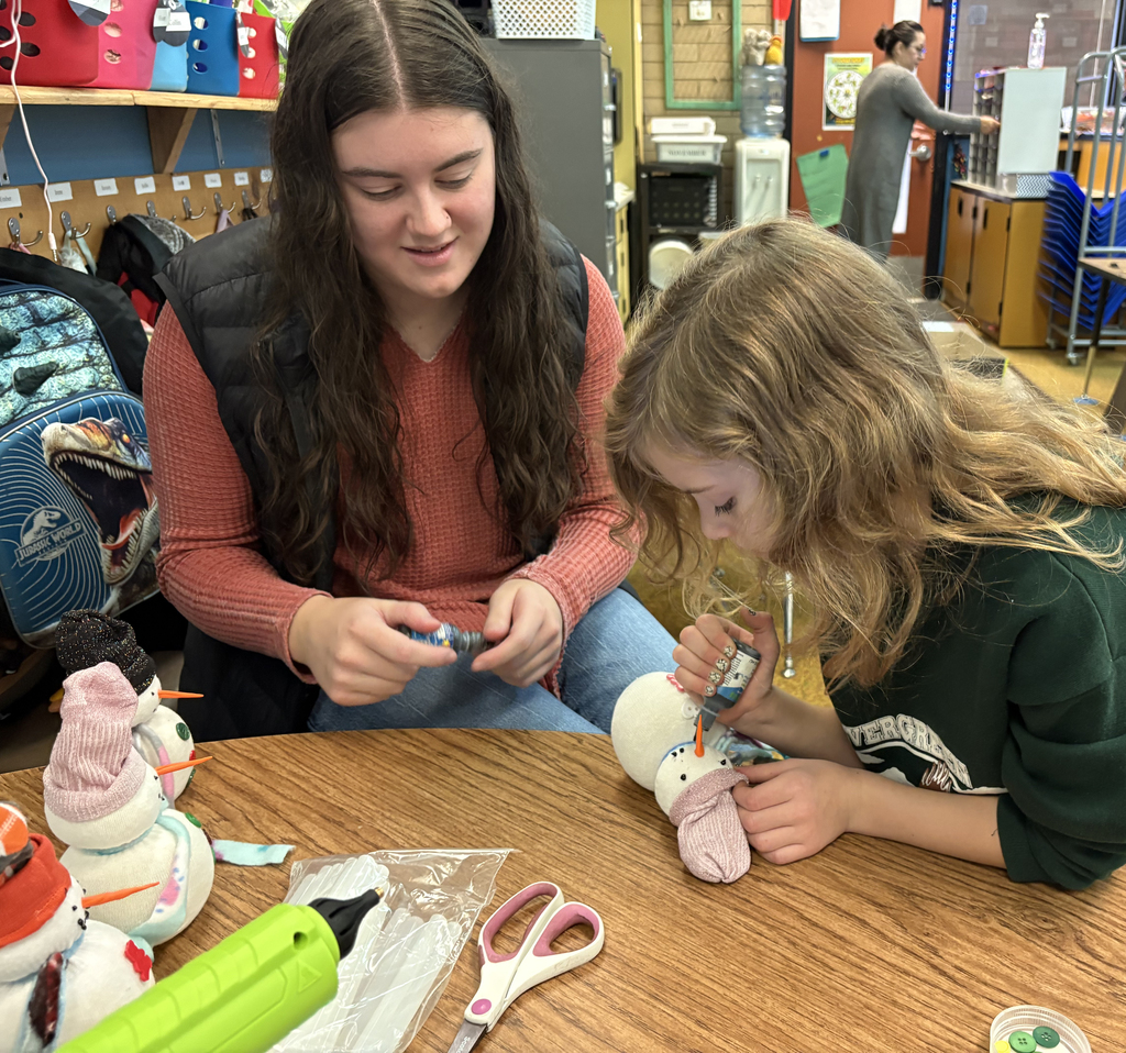 Adding some puffy paint coal eyes and mouth. 
