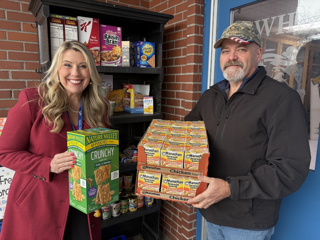 Sedro-Woolley High School Principal Kerri Carlton, a Rotarian, and current Rotary Club President Lin Tucker stocking the pantries at the high school Thursday afternoon.