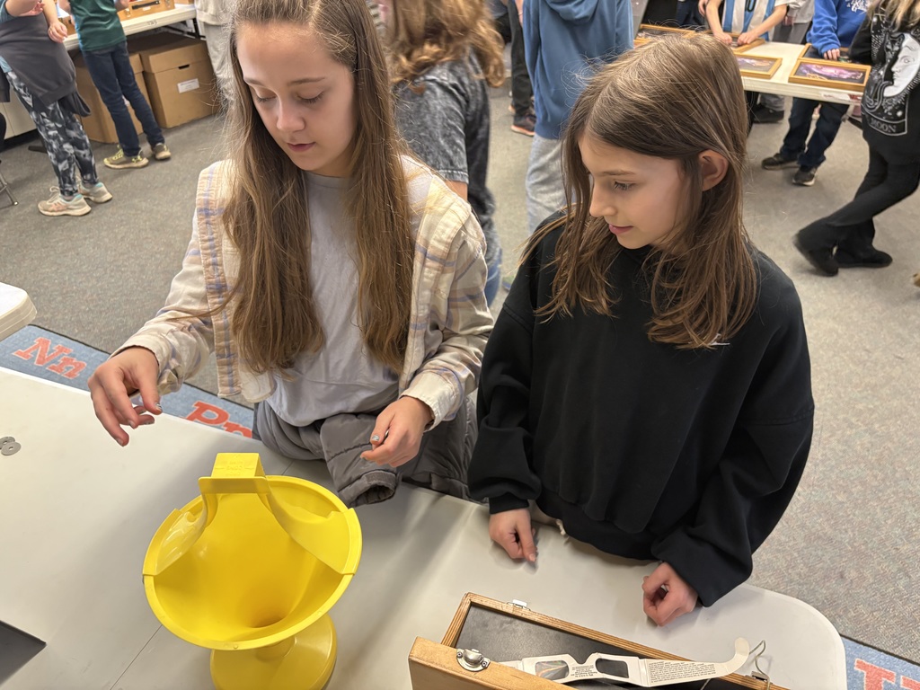 Students explore science concepts through interactive materials.