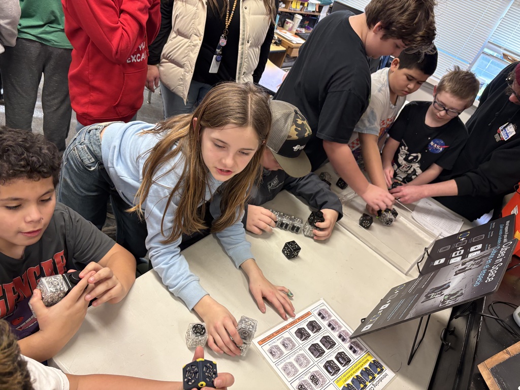 Students explore science concepts through interactive materials.