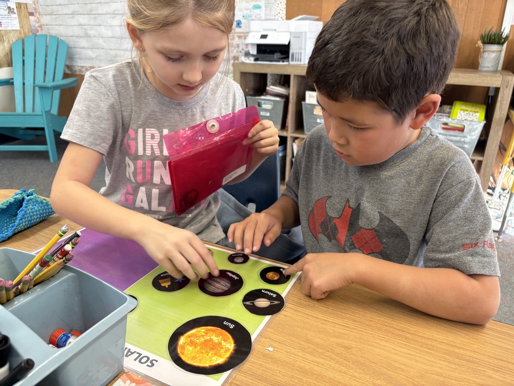 Students explore science concepts through interactive materials.