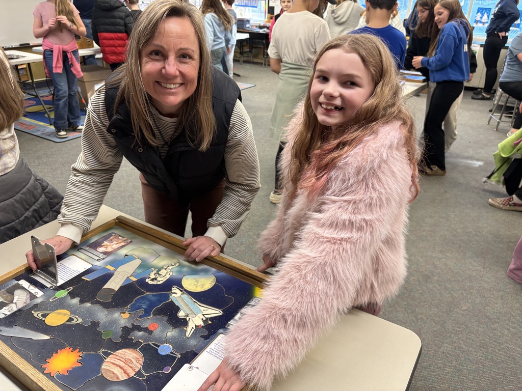 Students explore science concepts through interactive materials.